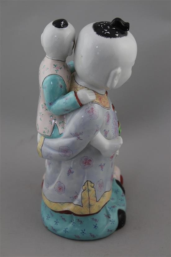 A Chinese enamelled porcelain group of boys, 20th century, 31cm